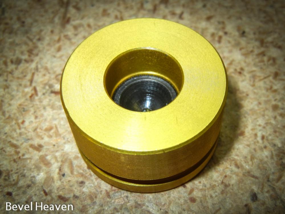 The slave piston showing the installed hardened button